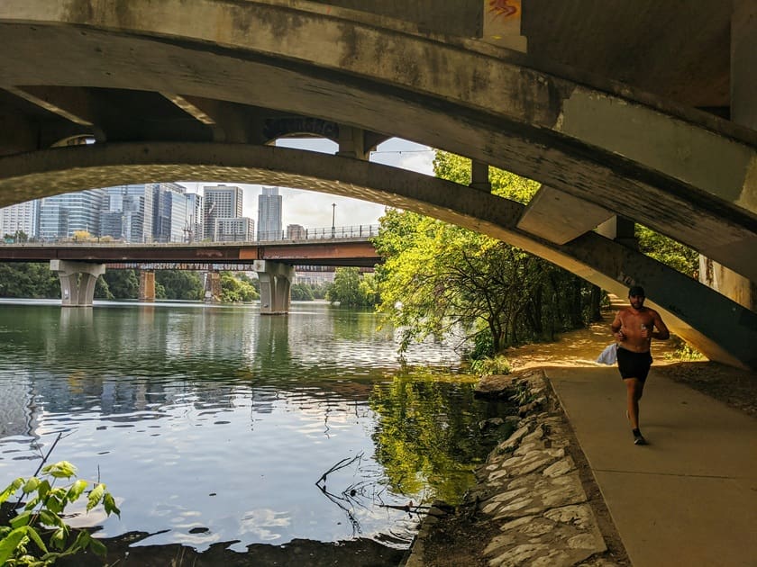 Happy Toronto resident walking outdoors to help keep the spine healthy