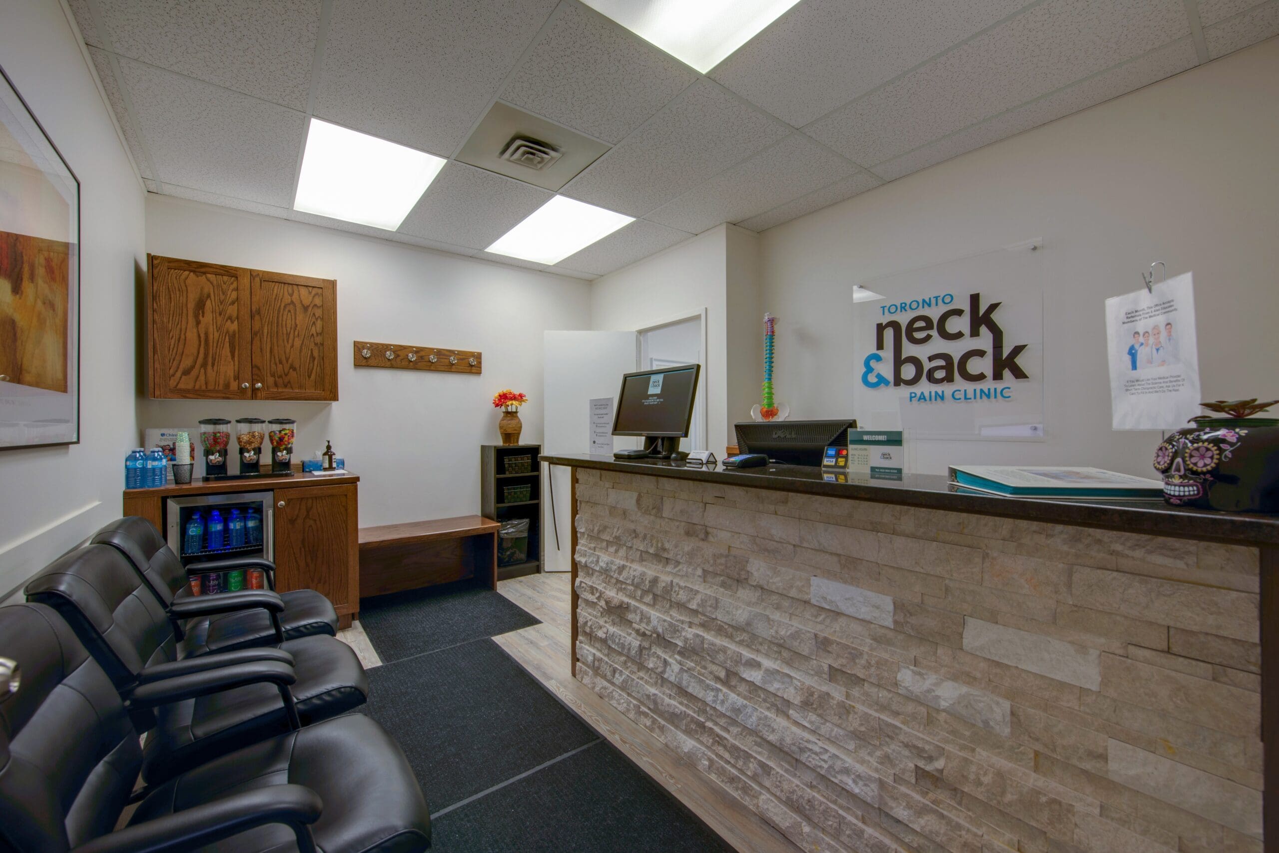 Modern reception area at Toronto Neck and Back Pain Clinic with a welcoming, professional atmosphere